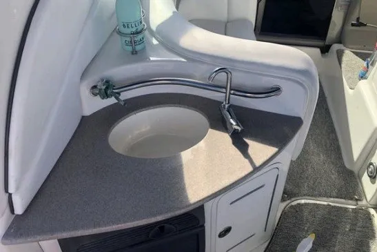 Slide: The Image of 2006 Sea Ray Sundancer 320 boat interior with sink and countertop. - 10