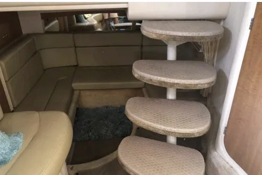 Slide: The Image of Interior of 2006 Sea Ray Sundancer 320 with curved seating and spiral staircase. - 11