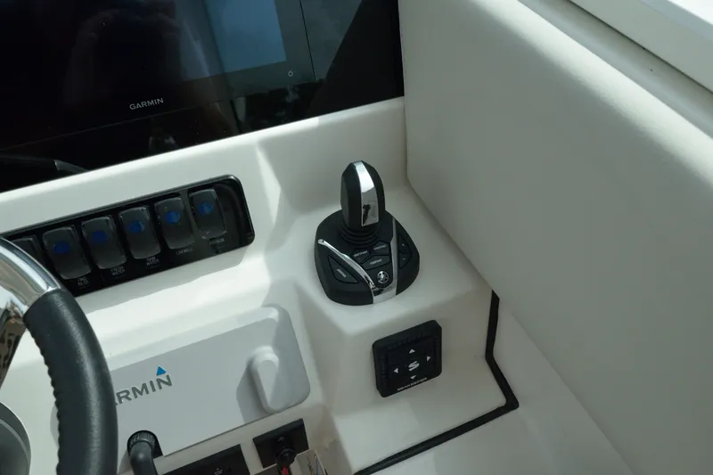 Slide: The Image of Control panel of 2027 Sailfish 316 DC boat with Garmin display and joystick. - 19