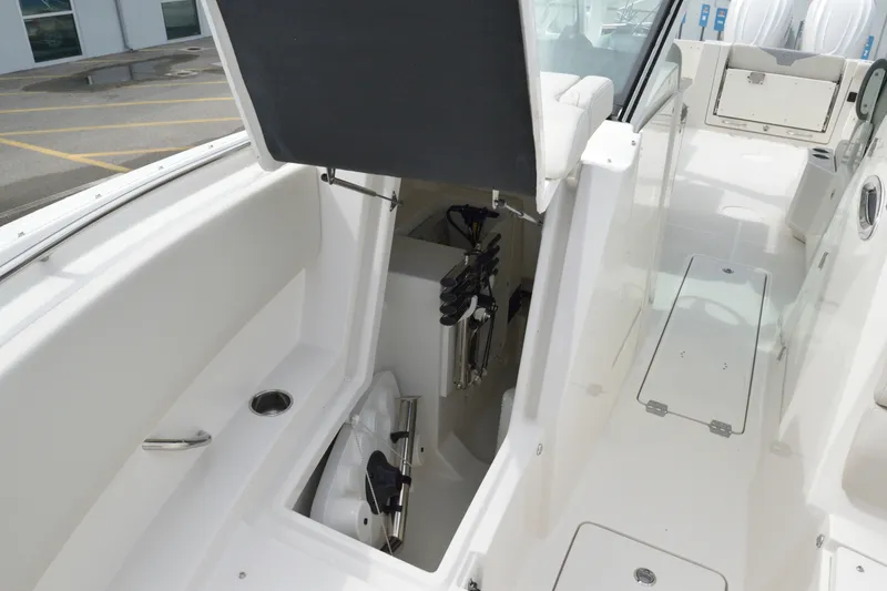 Slide: The Image of 2027 Sailfish 316 DC boat interior with open storage compartment. - 24