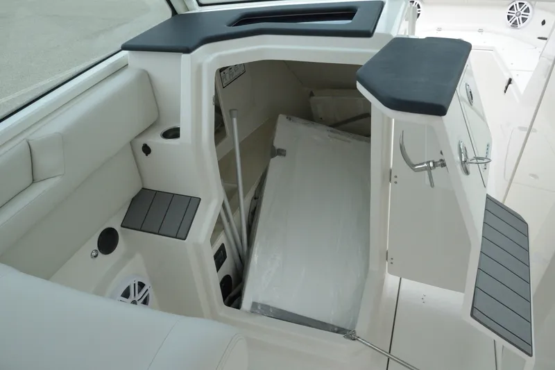 Slide: The Image of Interior storage compartment of 2027 Sailfish 316 DC boat, featuring sleek design and ample space. - 15