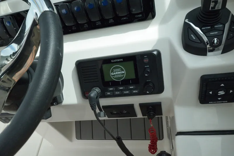 Slide: The Image of Control panel of 2027 Sailfish 316 DC boat featuring Garmin navigation system. - 20