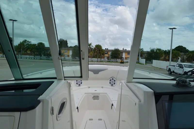 Slide: The Image of Interior view of 2027 Sailfish 316 DC boat with windshield and seating area. - 16