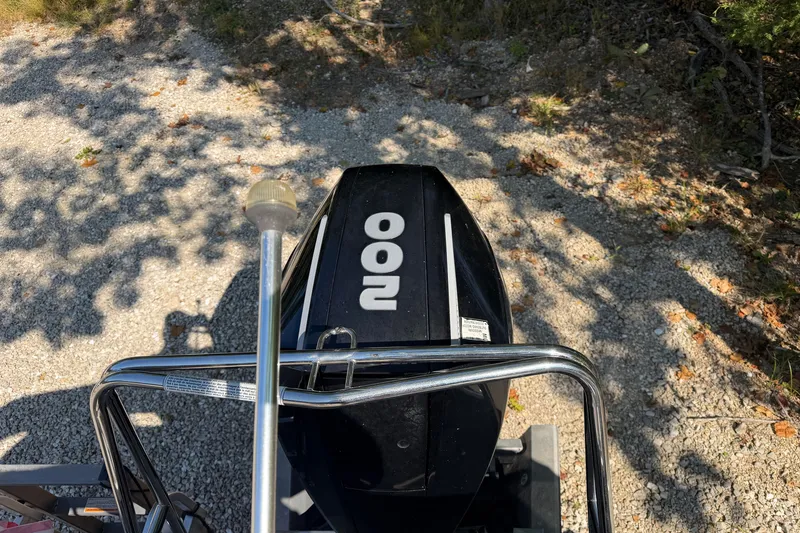 Slide: The Image of 2019 Princecraft Vectra 25 boat engine with "200" label, parked on gravel path. - 33