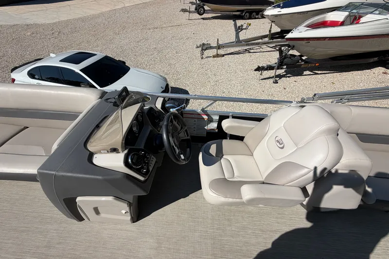 Slide: The Image of 2019 Princecraft Vectra 25 boat interior with steering console and seating. - 21