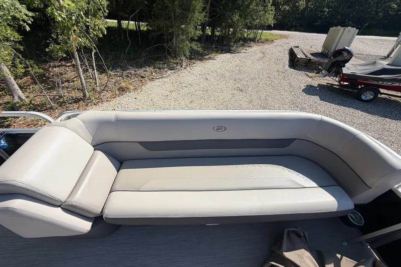 Slide: The Image of 2019 Princecraft Vectra 25 boat with spacious seating, parked on gravel near trees. - 17
