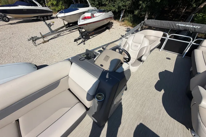 Slide: The Image of 2019 Princecraft Vectra 25 pontoon boat interior with steering console and seating. - 19