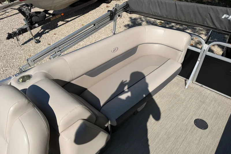 Slide: The Image of 2019 Princecraft Vectra 25 boat interior with beige seating and cup holder. - 27