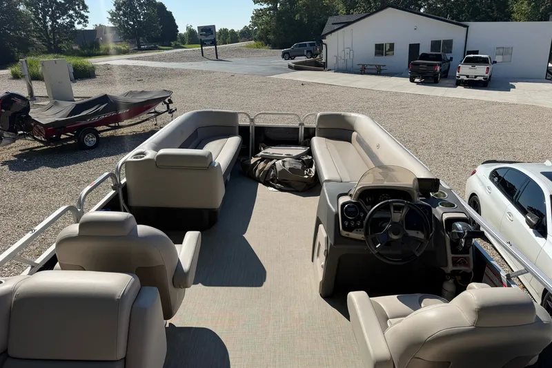 Slide: The Image of 2019 Princecraft Vectra 25 pontoon boat with spacious seating and modern dashboard. - 30