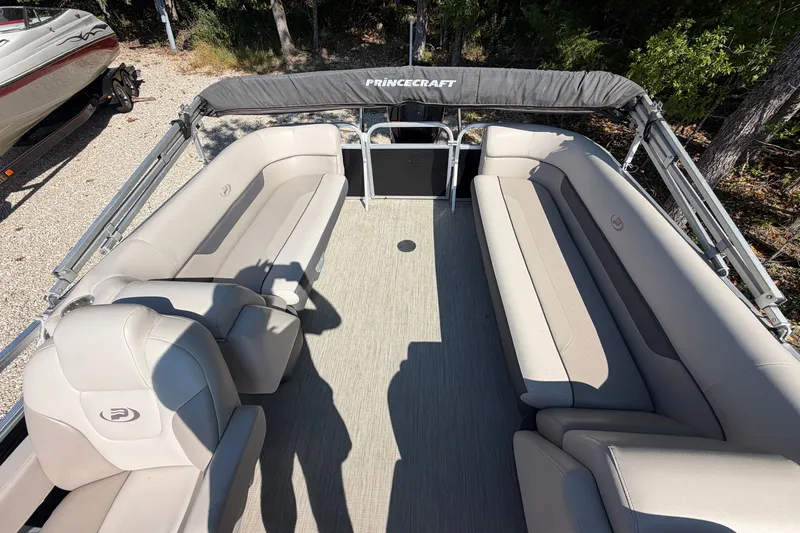 Slide: The Image of 2019 Princecraft Vectra 25 pontoon boat interior with beige seating and canopy. - 29