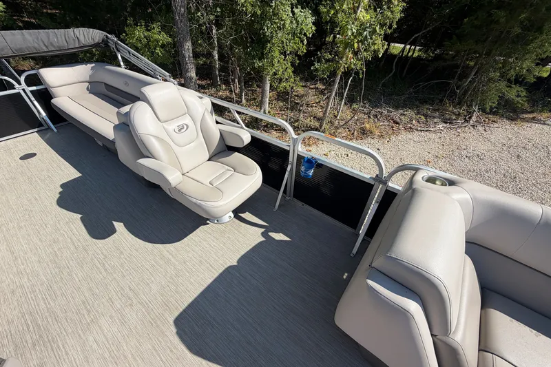 Slide: The Image of 2019 Princecraft Vectra 25 pontoon boat interior with beige seating and railing. - 18