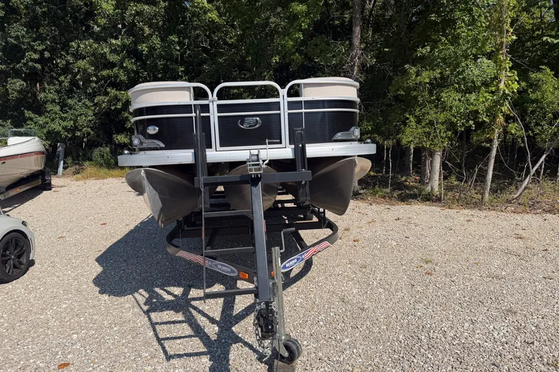 Slide: The Image of 2019 Princecraft Vectra 25 pontoon boat on trailer, parked on gravel near trees. - 11