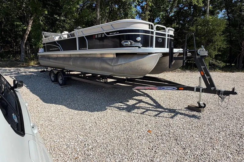 Slide: The Image of 2019 Princecraft Vectra 25 pontoon boat on trailer in a gravel lot. - 10