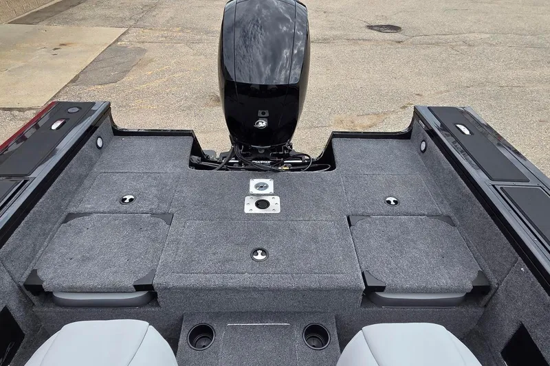 Slide: The Image of 2027 Tracker Targa V-18 Combo boat interior with motor, featuring spacious seating and storage. - 15