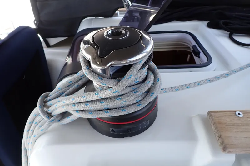 Slide: The Image of Winch with rope on 2018 Jeanneau Sun Odyssey 389 sailboat deck. - 101