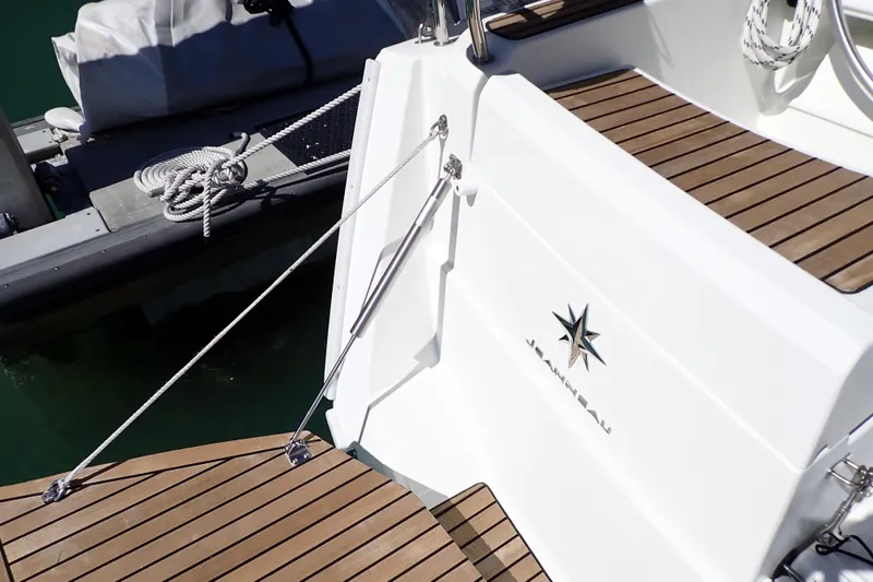 Slide: The Image of 2018 Jeanneau Sun Odyssey 389 yacht with teak deck and mooring ropes. - 74