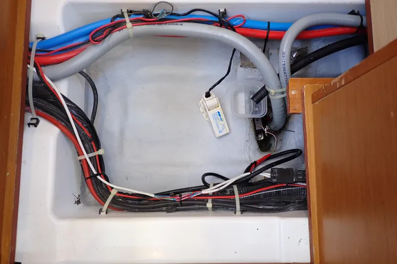 Slide: The Image of Electrical wiring and plumbing inside a 2018 Jeanneau Sun Odyssey 389 sailboat. - 139