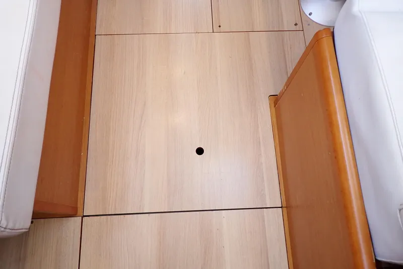 Slide: The Image of Wooden floor detail inside 2018 Jeanneau Sun Odyssey 389 sailboat cabin. - 138