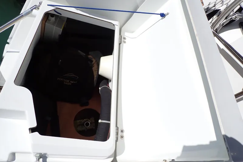 Slide: The Image of Open storage compartment on 2018 Jeanneau Sun Odyssey 389 sailboat deck. - 77
