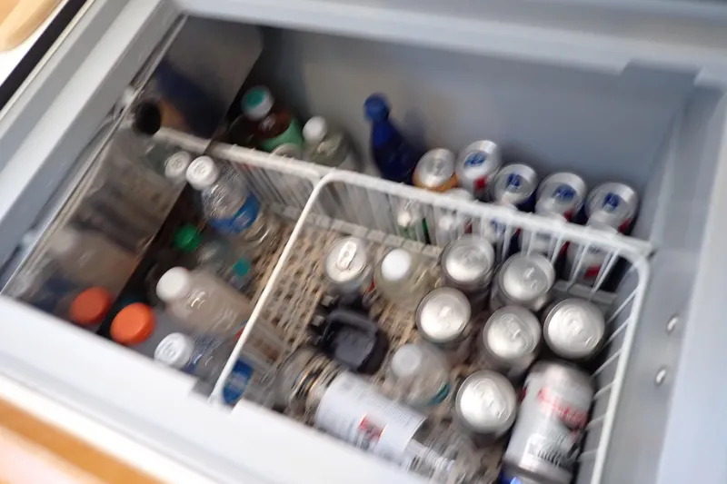 Slide: The Image of Refrigerator stocked with drinks on 2018 Jeanneau Sun Odyssey 389 sailboat. - 113