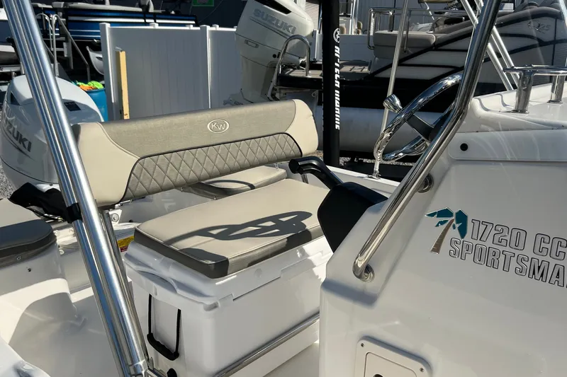 Slide: The Image of 2026 Key West 1720 Center Console boat interior with steering wheel and seating. - 12