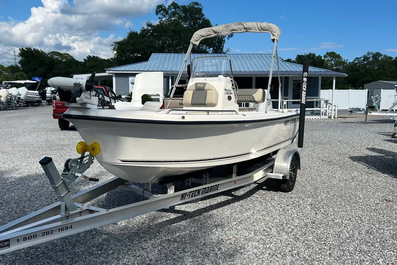 The Image of 2026 Key West 1720 Center Console boat on trailer in outdoor dealership setting. - 0