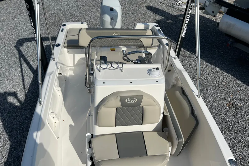 Slide: The Image of 2026 Key West 1720 Center Console boat interior with seating and steering wheel. - 10