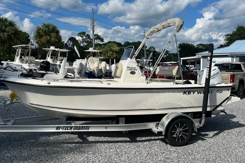Slide: The Image of 2026 Key West 1720 Center Console boat on trailer, displayed outdoors. - 1
