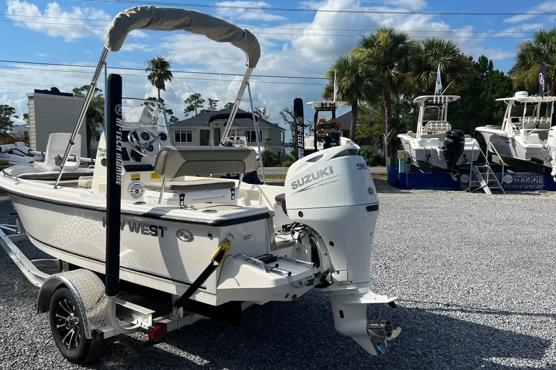 Slide: The Image of 2026 Key West 1720 Center Console boat with Suzuki engine on trailer. - 2