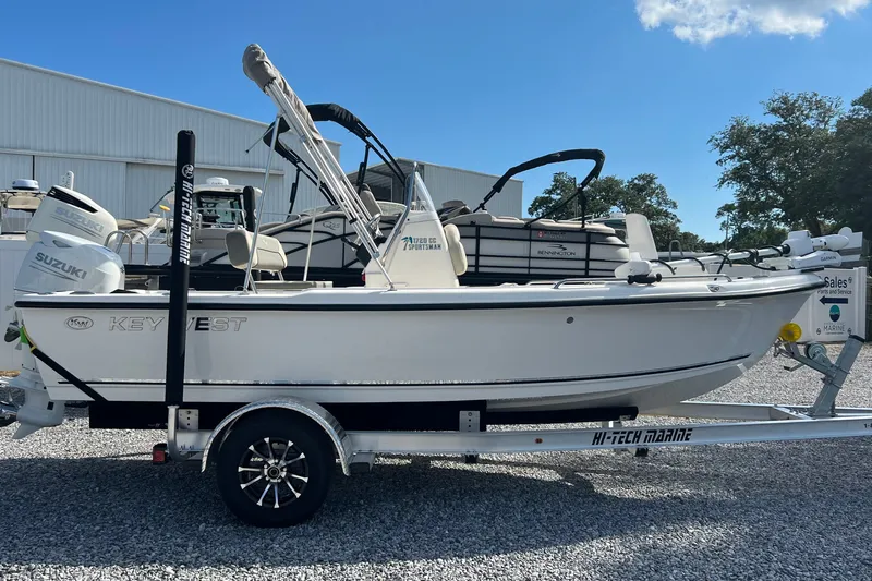 Slide: The Image of 2026 Key West 1720 Center Console boat on trailer, featuring Suzuki outboard motor. - 5