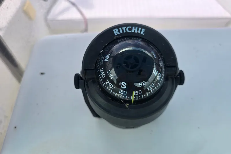 Slide: The Image of Ritchie compass on 2004 Sea Boss 180 Center Console boat dashboard. - 23