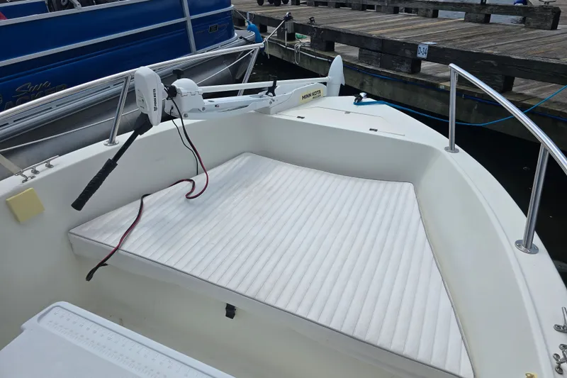 Slide: The Image of 2004 Sea Boss 180 Center Console boat with Minn Kota trolling motor at dock. - 11