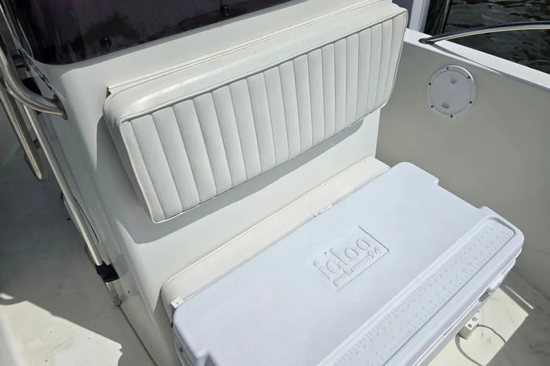 Slide: The Image of White seating and cooler on 2004 Sea Boss 180 Center Console boat. - 28