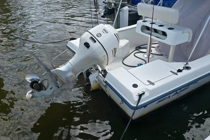 Slide: The Image of 2004 Sea Boss 180 Center Console boat with outboard motor on water. - 5