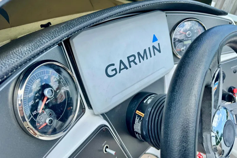 Slide: The Image of Dashboard of 2022 Hurricane Sundeck Sport 218 OB with Garmin display and gauges. - 11