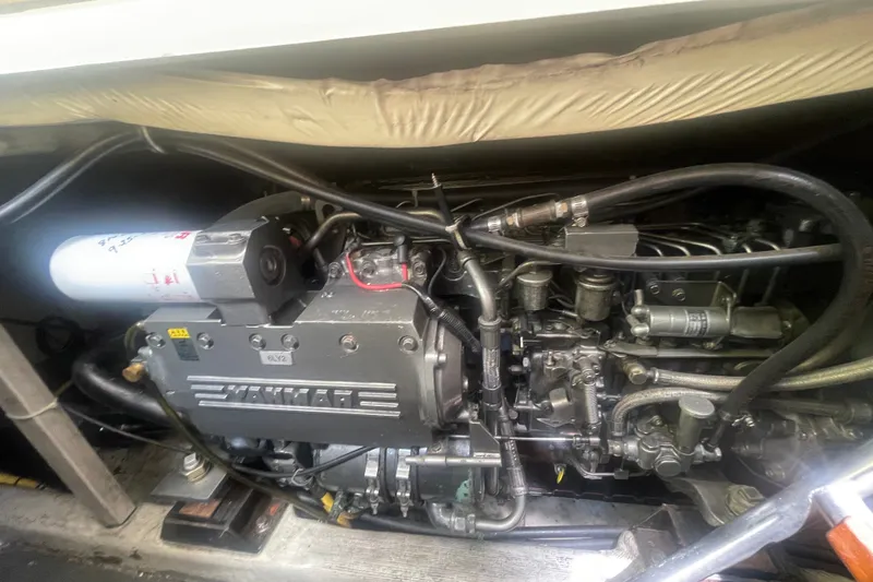 Slide: The Image of Engine compartment of a 2001 Sabre 36 Express boat, featuring a Yanmar engine. - 37