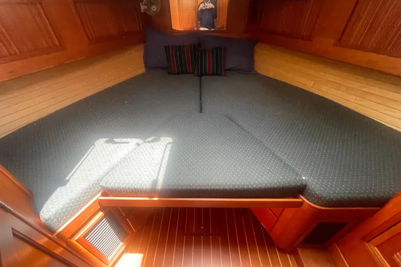 Slide: The Image of Interior cabin of 2001 Sabre 36 Express yacht with cozy bedding and wooden paneling. - 26