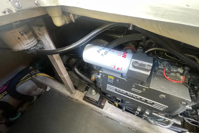 Slide: The Image of Engine compartment of a 2001 Sabre 36 Express boat, showing filters and wiring. - 38