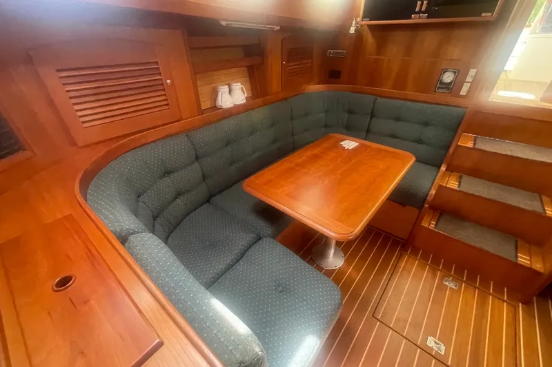 Slide: The Image of Luxurious 2001 Sabre 36 Express yacht interior with cozy seating and wooden table. - 20