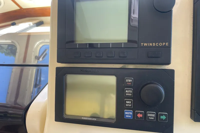 Slide: The Image of Control panel of a 2001 Sabre 36 Express boat with navigation instruments. - 12