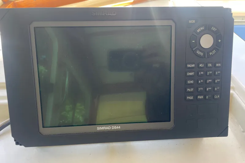 Slide: The Image of Simrad DS44 marine navigation system on a 2001 Sabre 36 Express boat. - 16