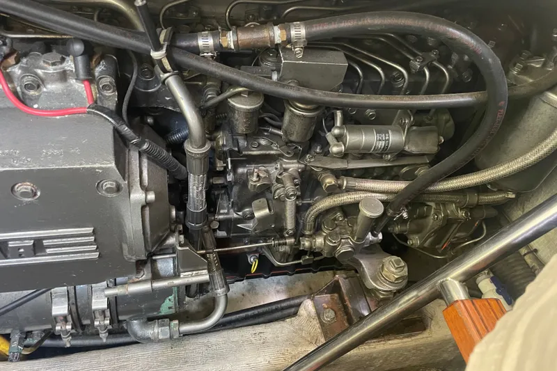 Slide: The Image of Engine compartment of a 2001 Sabre 36 Express boat, showcasing intricate mechanical components. - 36
