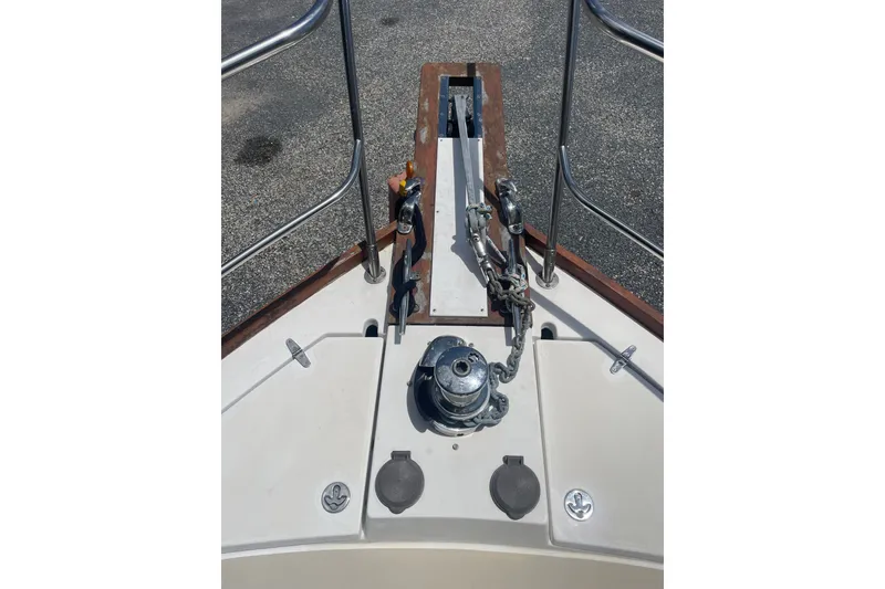 Slide: The Image of Bow of 2001 Sabre 36 Express boat with anchor windlass and chain. - 33