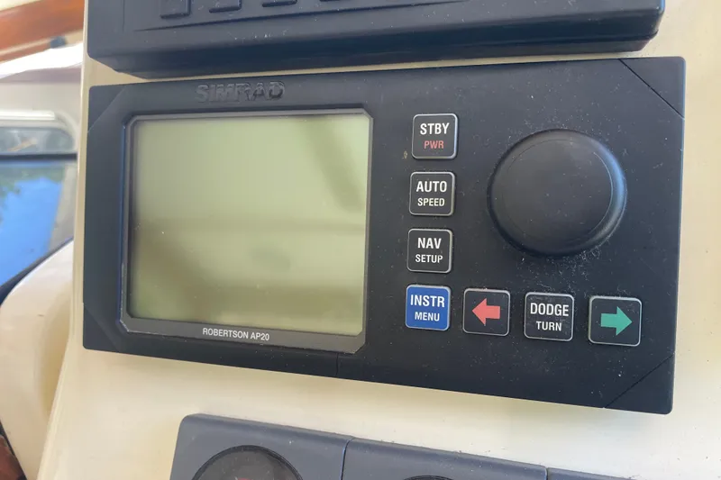 Slide: The Image of Simrad Robertson AP20 autopilot control panel on a 2001 Sabre 36 Express boat. - 13