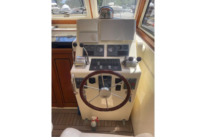 Slide: The Image of Helm of 2001 Sabre 36 Express boat with steering wheel and control panel. - 7