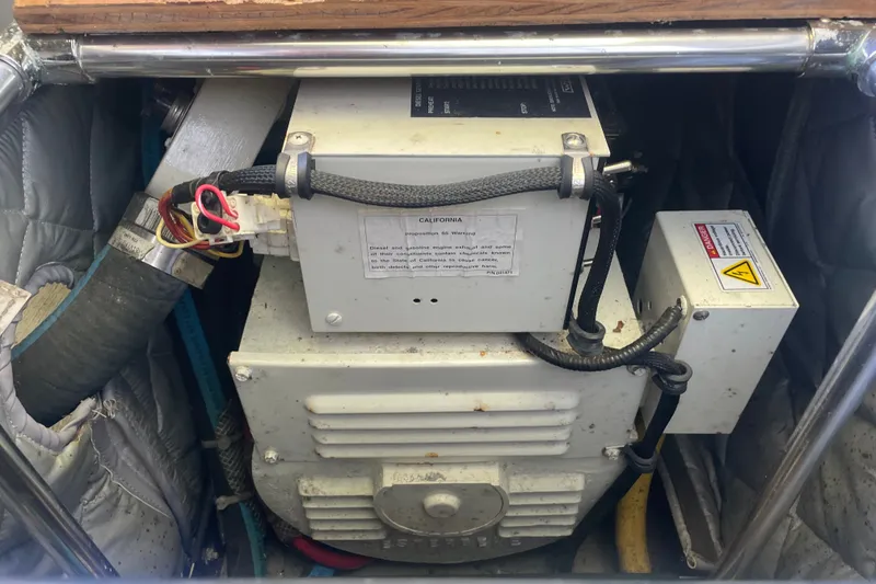 Slide: The Image of Engine compartment of a 2001 Sabre 36 Express boat, showing electrical components and wiring. - 39