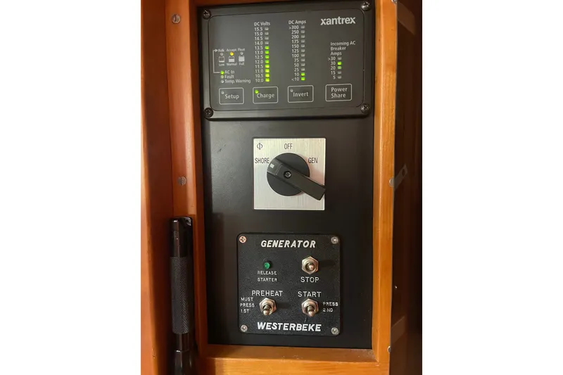 Slide: The Image of Control panel of a 2001 Sabre 36 Express boat featuring Xantrex and Westerbeke generator controls. - 22