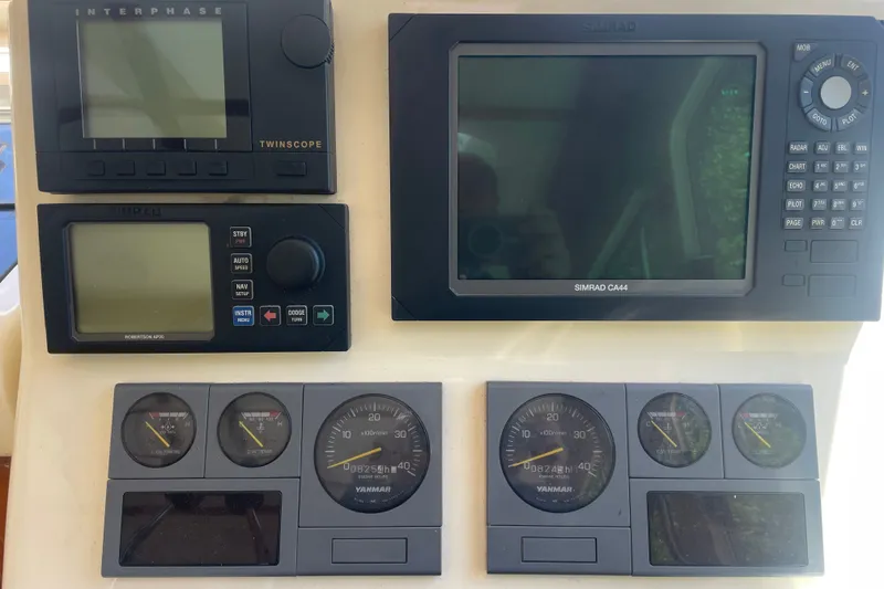 Slide: The Image of Control panel of a 2001 Sabre 36 Express boat with navigation instruments. - 11