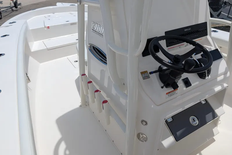Slide: The Image of 2027 Pathfinder 2700 Tournament boat interior with steering console and rod holders. - 26