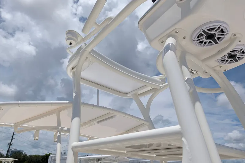 Slide: The Image of Pathfinder 2700 Tournament 2027 boat structure with speakers against a cloudy sky. - 47